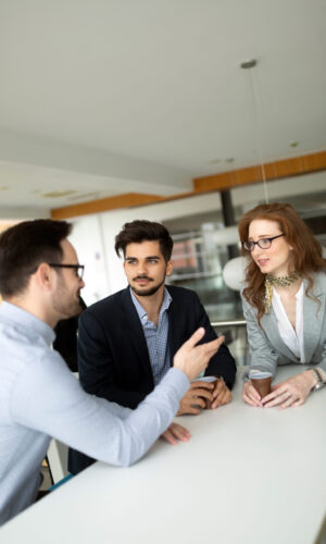 Business partners and colleagues having conversation during coffee break